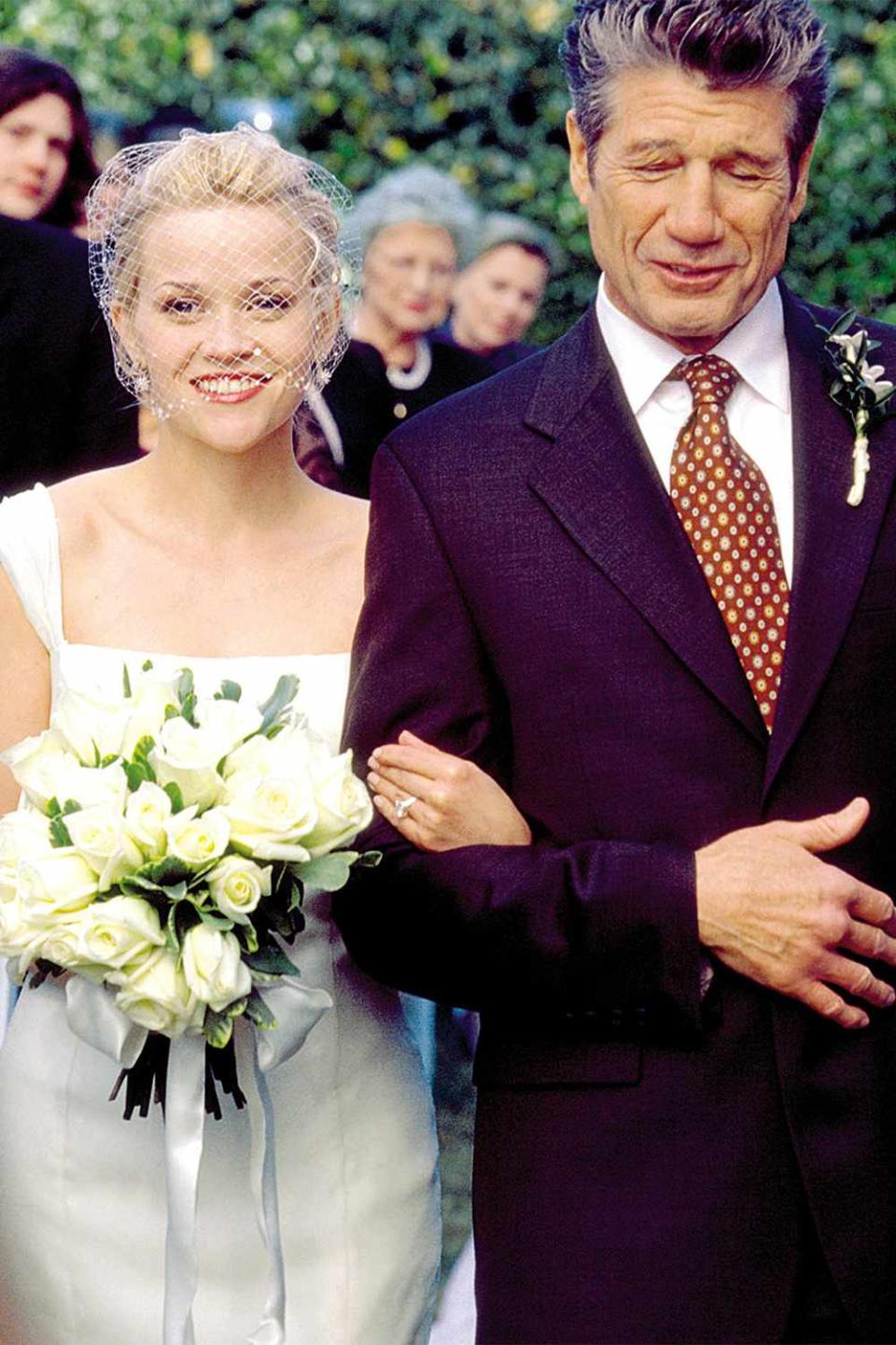 Reese Witherspoon in a wedding dress, Fred Ward in a suit