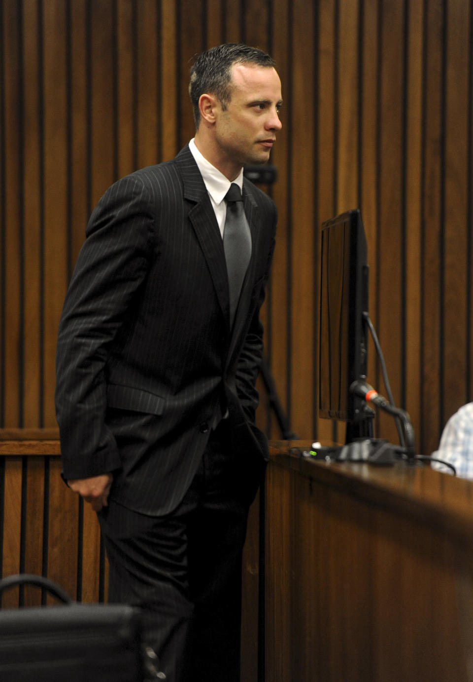 Oscar Pistorius, arrives in court of his murder trial in Pretoria, South Africa, Tuesday, March 18, 2014. Pistorius is on trial for the murder of his girlfriend Reeva Steenkamp on Valentines Day, 2013. (AP Photo/Werner Beukes, Pool)