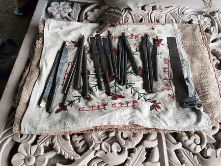 Tools used to carve out stones that Hindu nationalist group Vishva Hindu Parishad (VHP) say will be used to build a Ram temple at the disputed religious site are pictured in Ayodhya in the northern state of Uttar Pradesh, India, June 16, 2016. REUTERS/Rupam Jain