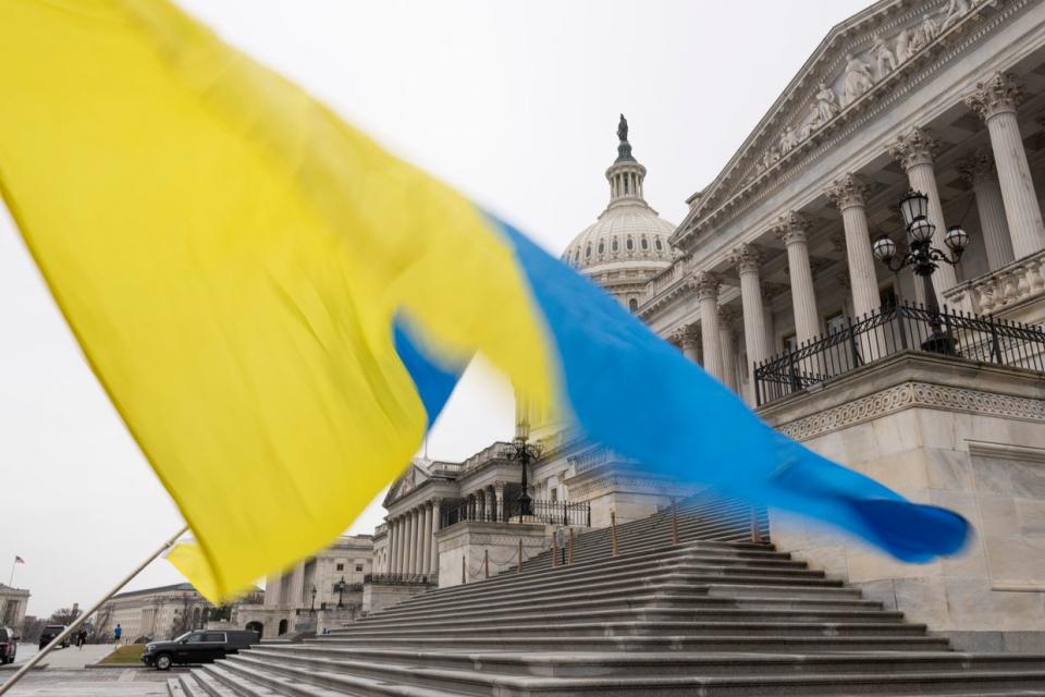 Ukraine sympathizers fly a Ukrainian flag outside as the Senate works through the weekend on a $95.3 billion foreign aid bill with assistance for Ukraine and Israel at the U.S. Capitol in Washington, DC on Feb. 11, 2024. (Photo by Roberto Schmidt/Getty Images)