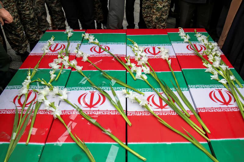 The coffins of the four Iranian victims of the Ukrainian plane crash in Iran, are seen during their funeral ceremony in Hamadan