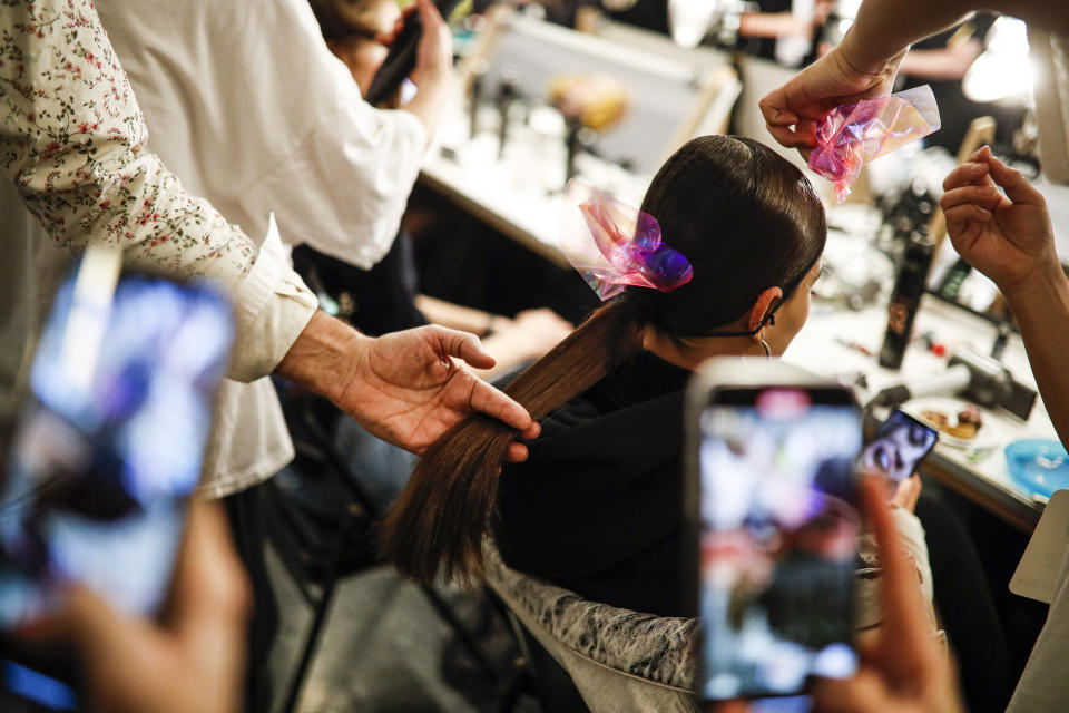 A model is prepared backstage before the Brandon Maxwell collection is modeled during Fashion Week, Saturday, Feb. 8, 2020, in New York. (AP Photo/John Minchillo)