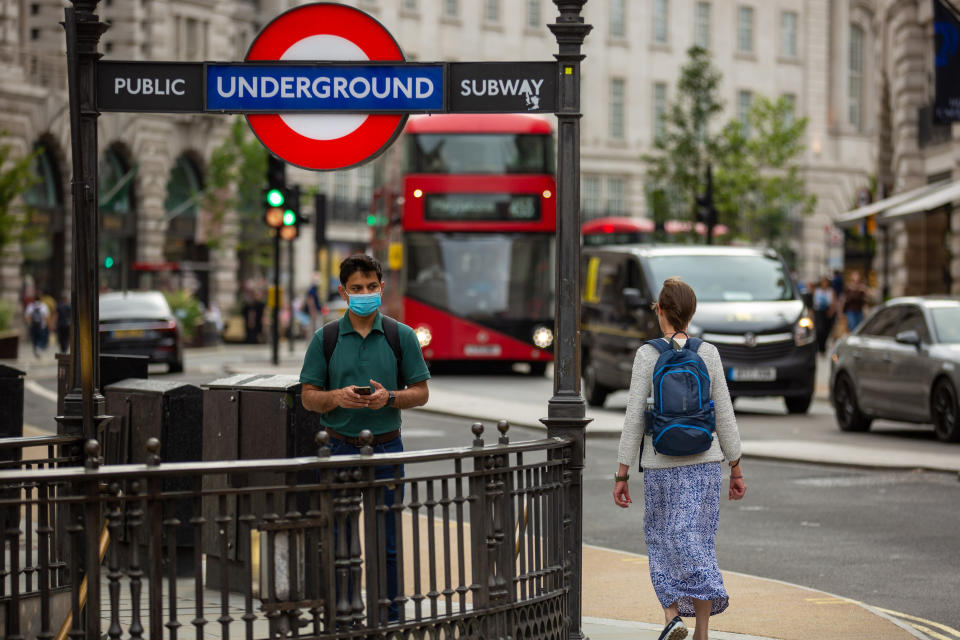 PICCADILLY, LONDON, UNITED KINGDOM - 2021/07/23: A man wearing a mask as a preventive measure against the spread of covid-19 walks into Piccadilly Circus underground tube station in London.
The number of new COVID cases in the UK has fallen for the third day in a row, according to government data. The country has recorded 36,389 new cases and 64 more coronavirus-related deaths in the latest 24-hour period. (Photo by Pietro Recchia/SOPA Images/LightRocket via Getty Images)