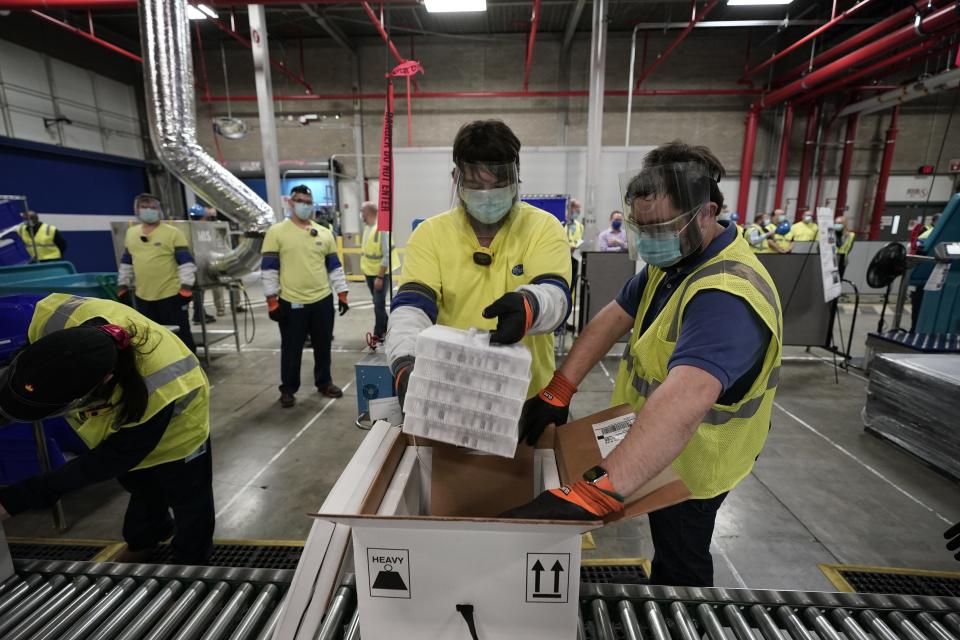 PORTAGE, MICHIGAN - DECEMBER 13: Boxes containing the Pfizer-BioNTech COVID-19 vaccine are prepared to be shipped at the Pfizer Global Supply Kalamazoo manufacturing plant on December 13, 2020 in Portage, Michigan. (Photo by Morry Gash - Pool/Getty Images)