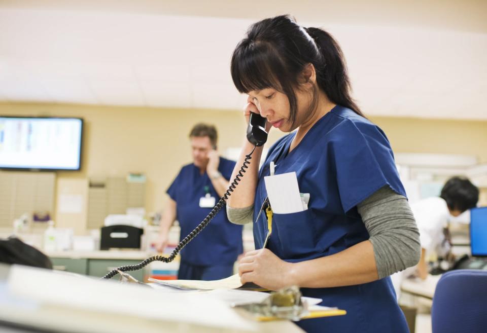 <span class="caption">Adding nurses and support personnel who are minorities is also critical.</span> <span class="attribution"><a class="link " href="https://www.gettyimages.com/detail/photo/nurse-checks-notes-while-talking-on-phone-royalty-free-image/114426892?adppopup=true" rel="nofollow noopener" target="_blank" data-ylk="slk:Getty Images / Reza Estakhrian;elm:context_link;itc:0;sec:content-canvas">Getty Images / Reza Estakhrian</a></span>