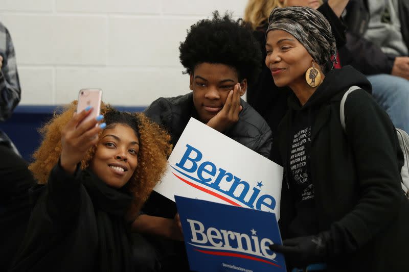 Supporters of U.S. Democratic presidential candidate Bernie Sanders listen to him speak during a rally in Dearborn, Michigan