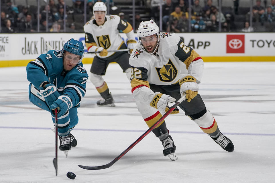 San Jose Sharks center Nico Sturm (7) and Vegas Golden Knights center Michael Amadio (22) chase after the puck during the second period of an NHL hockey game in San Jose, Calif., Tuesday, Oct. 25, 2022. (AP Photo/Godofredo A. Vásquez)