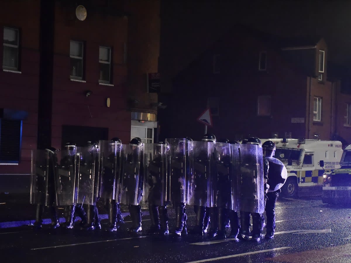 Police don riot shields as nationalists and loyalists riot in Belfast in April 2021 (Charles McQuillan/Getty Images)