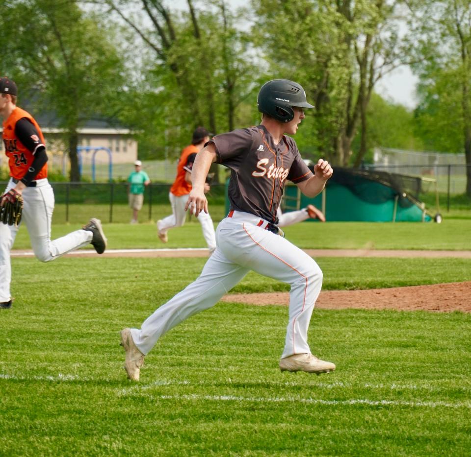 Luke Herman heads to first base after clubbing a hit against Dowagiac on Friday.