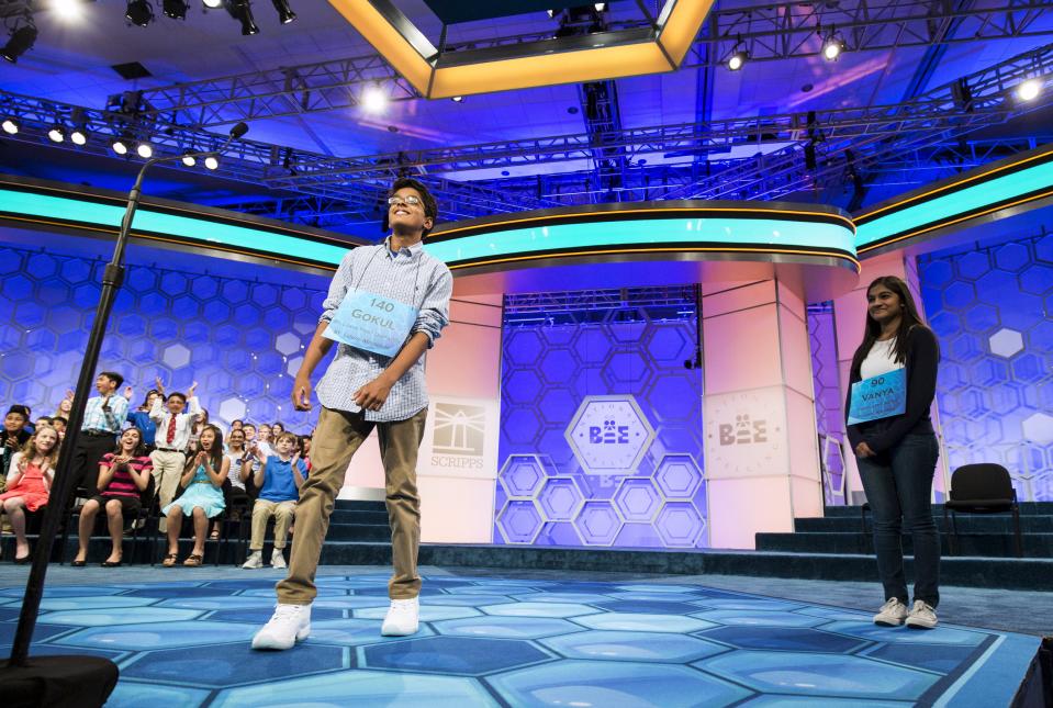 Vanya Shivashankar (R) of Olathe, Kansas, and Gokul Venkatachalam, St. Louis Missouri are co-champions after Venkatachalam spelling "nunatak" during the final round of the 88th annual Scripps National Spelling Bee at National Harbor, Maryland May 28, 2015. (REUTERS/Joshua Roberts)