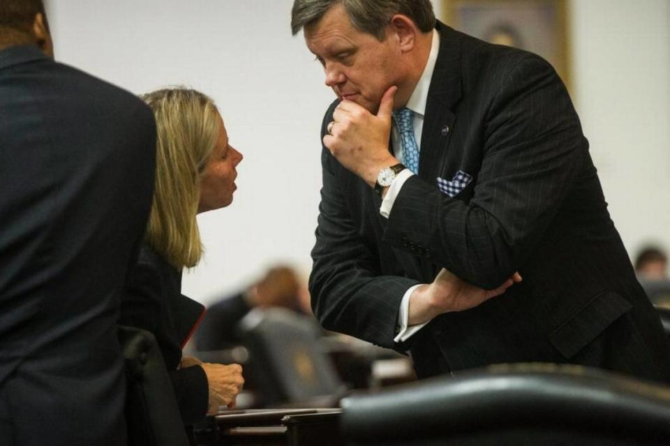 Democratic N.C. Sens. Terry Van Duyn from Asheville and Mike Woodard from Durham confer in the state Senate chambers on Dec. 21, 2016.