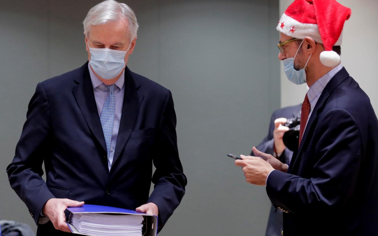 Michel Barnier, the EU's chief Brexit negotiator, and a colleague in festive garb - POOL EPA/Olivier Hoslet