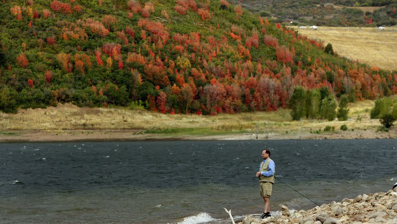 A fly fisherman enjoys the fall scenery before a storm arrived as he fishes on Jordanelle Reservoir in Summit County, Utah, on Sept. 14, 2006. The fall season can be a great time to travel.