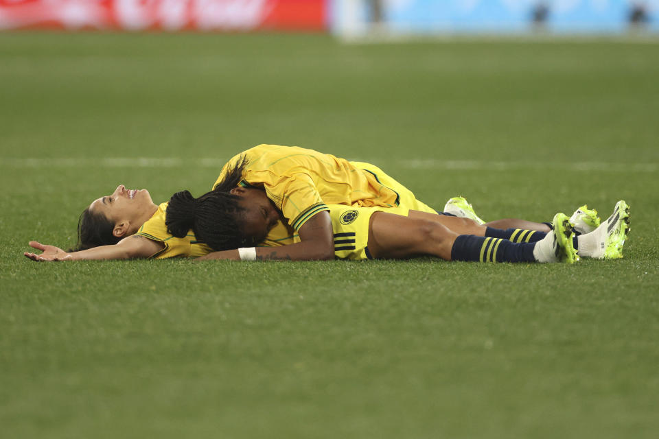 Colombia's Carolina Arias, left, and Colombia's Daniela Caracas celebrate at the end of the Women's World Cup round of 16 soccer match between Jamaica and Colombia in Melbourne, Australia, Tuesday, Aug. 8, 2023. (AP Photo/Hamish Blair)