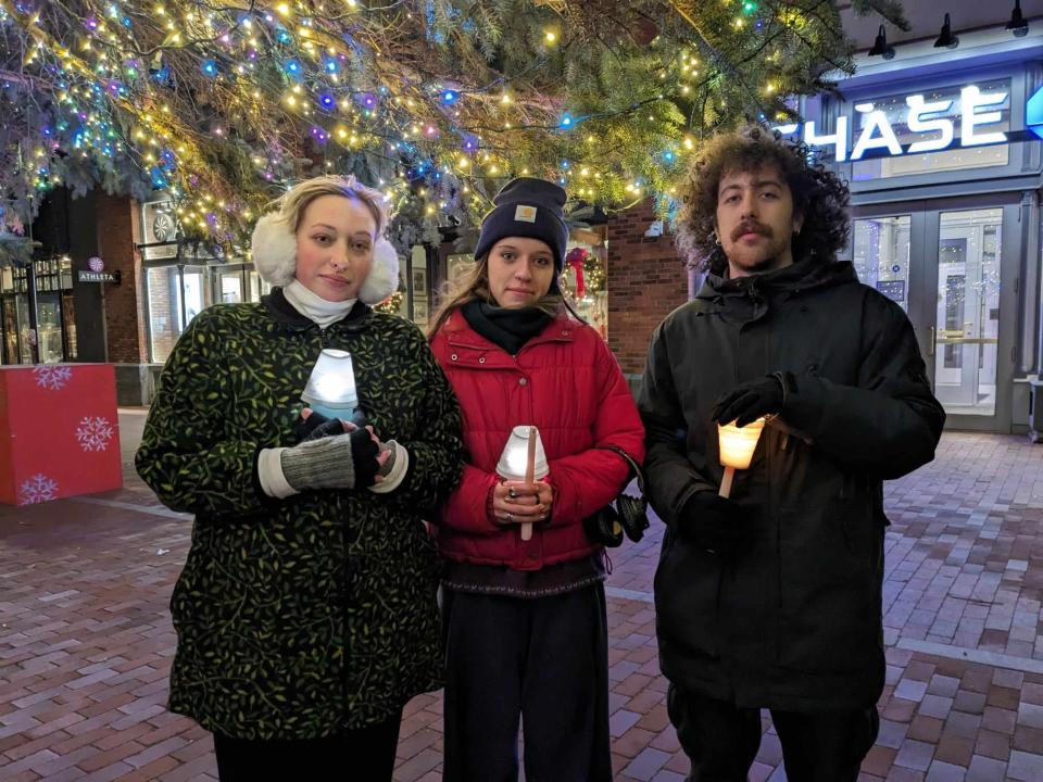 From left, UVM students Lucia Gallo, Lucy Bernard and Elias Fenichel-Hewitt attended a candlelight vigil on Church Street on Nov. 28, 2023, for the three Palestinian students who were hospitalized after being shot in Burlington over the weekend while on Thanksgiving break.