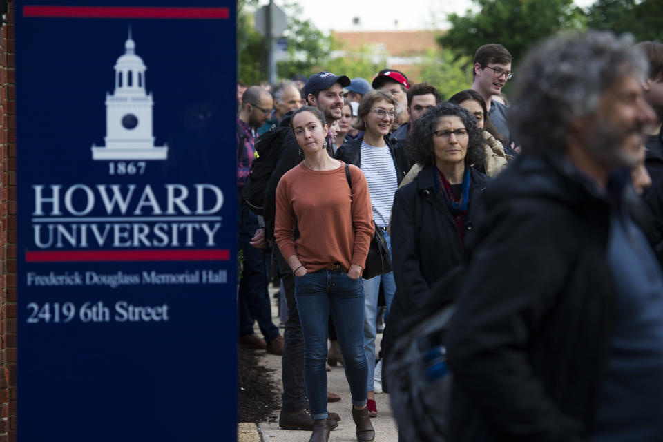 People wait in line to attend The Road to the Green New Deal Tour final event at Howard University in Washington, Monday, May 13, 2019. (AP Photo/Cliff Owen)