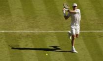 Andy Murray of Britain hits a shot during his match against Mikhail Kukushkin of Kazakhstan at the Wimbledon Tennis Championships in London, June 30, 2015. REUTERS/Henry Browne