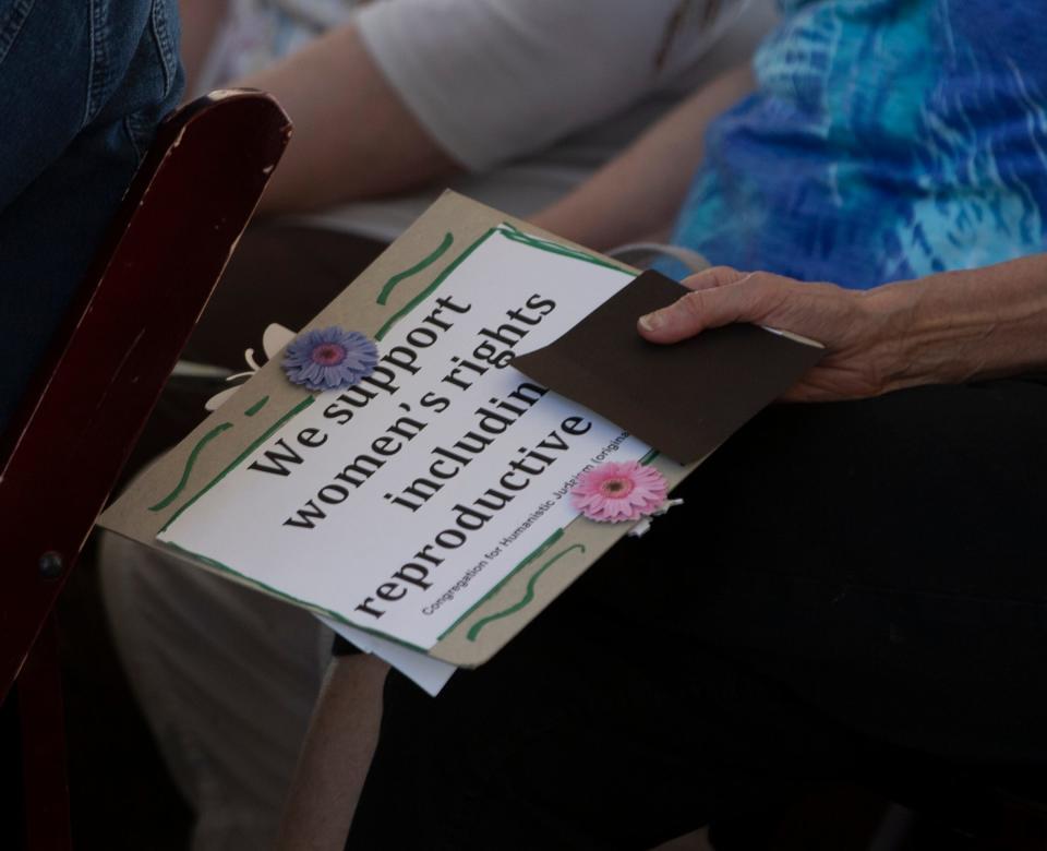 A participant holds a sign during the Abortion is a Jewish Value rally at Temple Israel in West Bloomfield on Wednesday, June 29, 2022.