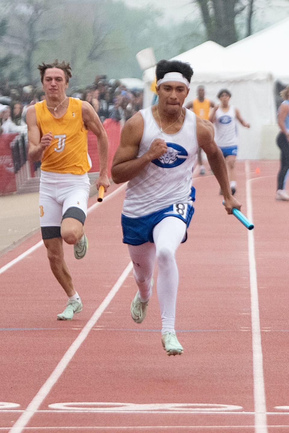 Josiah Barela of Pueblo Central approaches the finish line in the Class 4A boys 4x100-meter relay during day two of the CHSAA track and field state finals at Jeffco Stadium on May 19, 2023.