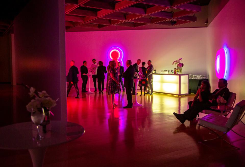 Guests mingle amid the gallery, "Phillip K. Smith III: Light + Change," during the 2023 Art Party at the Palm Springs Art Museum in Palm Springs, Calif., Saturday, Jan. 28, 2023. 