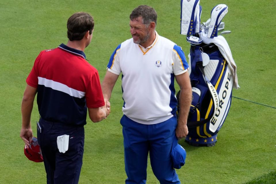 Lee Westwood shakes hands with Harris English after the former’s victory in the Ryder Cup singles (Ashley Landis/AP) (AP)