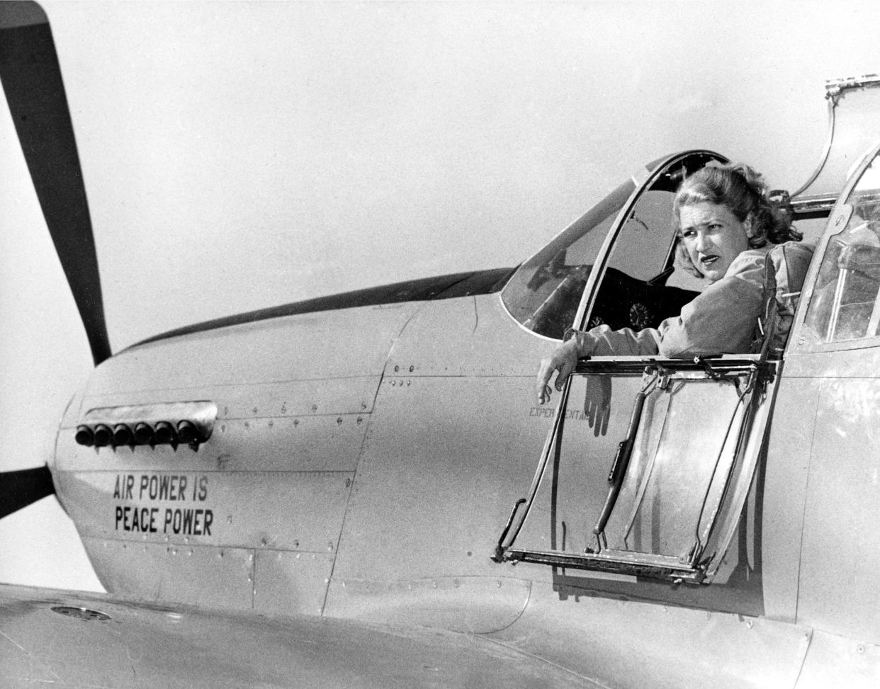 Pilot Jacqueline Cochran looks from the cockpit of her P-51 Mustang at Palm Springs, Ca., on Dec. 10, 1947.