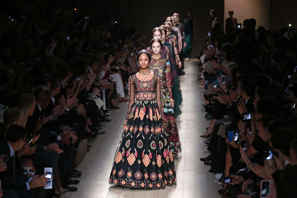 Models present creations by Italian designers Maria Grazia Chiuri and Pier Paolo Picciolo as part of their Spring/Summer 2014 women's ready-to-wear fashion show for fashion house Valentino during Paris fashion week