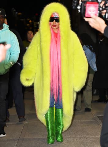 <p>James Devaney/GC Images</p> Nicki Minaj leaves "The Late Show With Stephen Colbert" in a neon green look