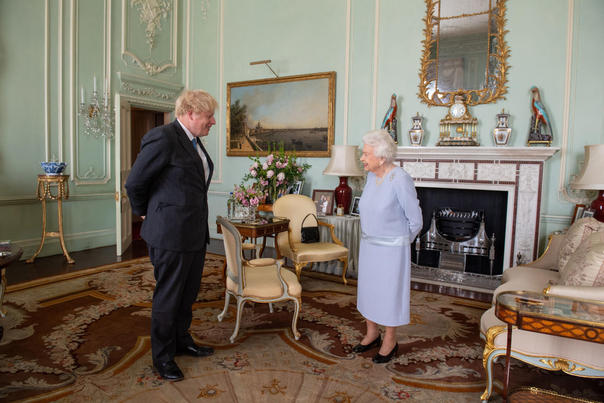 LONDON, ENGLAND - JUNE 23: Queen Elizabeth II greets Prime Minister Boris Johnson during the first in-person weekly audience with the Prime Minister since the start of the coronavirus pandemic at Buckingham Palace on June 23, 2021 in London, England. (Photo by Dominic Lipinski - WPA Pool/Getty Images)