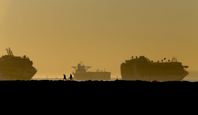 LONG BEACH, CA. - JAN. 14, 2021. Fishermen set up on the Long Beach side of the San Gabriel River jetty as the sun sets after an unseasonably warm winter day on Thursday, Jan. 14, 2021. (Luis Sinco/Los Angeles Times)