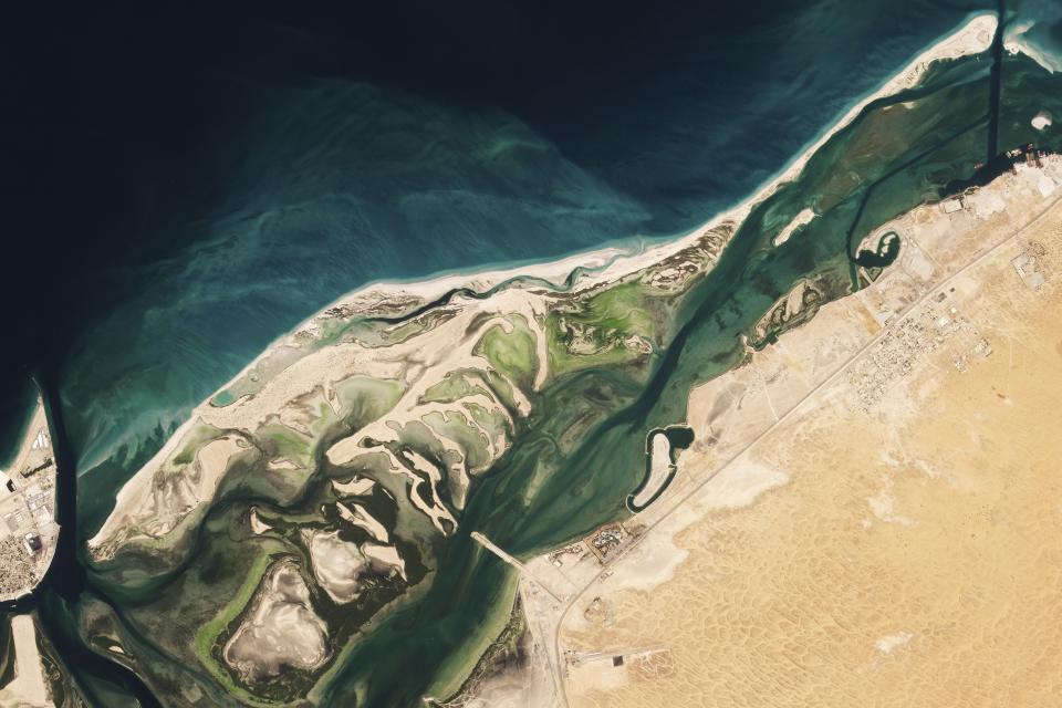 This satellite image from Planet Labs PBC shows Siniyah Island in Umm al-Quwain, United Arab Emirates, Thursday, March 16, 2023. Archaeologists said Monday, March 20, 2023, that they have found the oldest pearling town in the Persian Gulf on an island off one of its northern sheikhdoms of the United Arab Emirates, further expanding this young nation's understanding of its pre-Islamic history. (Planet Labs PBC via AP)