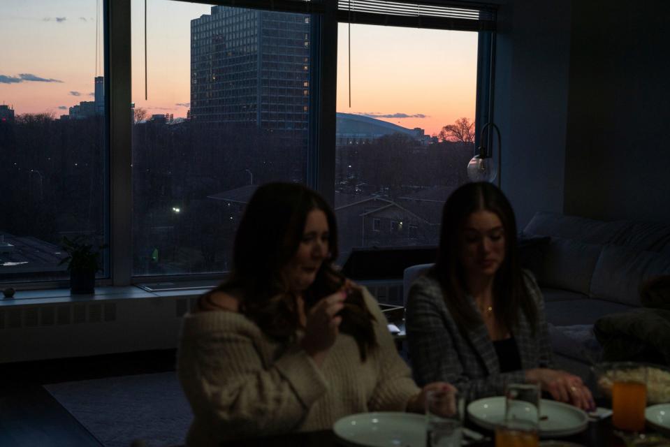 Megan Blue, of Lansing, left, and Kate Kelly, of Detroit, both 31, gather for Iftar, a fast-breaking meal that begins after sunset during Ramadan, on Tuesday, March 28, 2023. Blue and Kelly fasted for the day to support their friend, Detroit Free Press reporter Dana Afana.