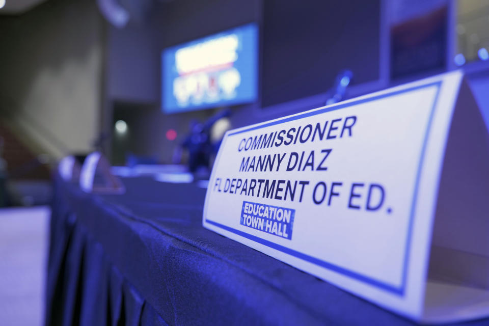 A placard for Commissioner Many Diaz is seen, Thursday, Aug. 10, 2023 in Miami Garden, Fla. Lawmakers, teachers, school board members and parents crowded into a South Florida church Thursday evening for a forum on Florida's new standards for teaching Black history. But one person who didn't attend after previously RSVPing was on the minds of most participants — Florida Education Commissioner Manny Diaz, the man responsible for overseeing the standards. (AP Photo/Daniel Kozin)