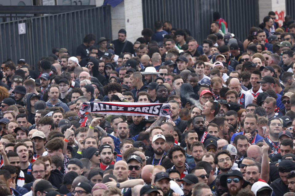 Paris Saint-Germain supporters arrive at the Olimpic Lluis Companys stadium for the Champions League quarterfinal second leg soccer match between Barcelona and Paris Saint-Germain in Barcelona, Spain, Tuesday, April 16, 2024. (AP Photo/Joan Monfort)