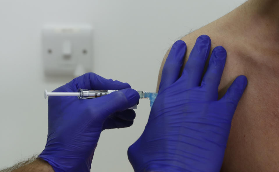 FILE - In this Wednesday, Oct. 7, 2020, file photo, a Phase 3 Novavax coronavirus vaccine trial volunteer is given an injection at St George's University hospital in London. Novavax says its vaccine appears effective against COVID-19 in a large study, including against variants. Results from the study in the U.S. and Mexico were released on Monday, June 14, 2021. (AP Photo/Alastair Grant, File)