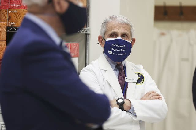 <p>Oliver Contreras/getty</p> Dr. Fauci speaking with President Joe Biden in 2021