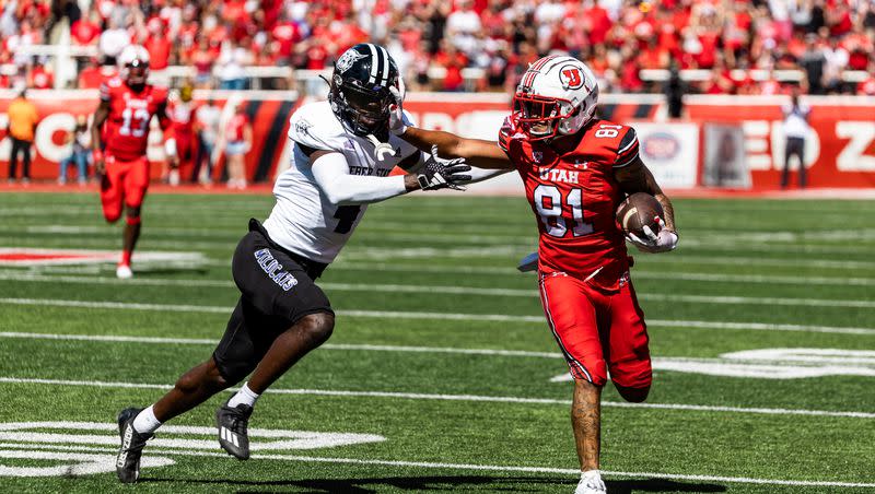 Utah wide receiver Mikey Matthews runs the ball down the field with Weber State cornerback Abraham Williams in pursuit at Rice-Eccles Stadium in Salt Lake City on Saturday, Sept. 16, 2023. The Utes open Pac-12 play Saturday against UCLA.