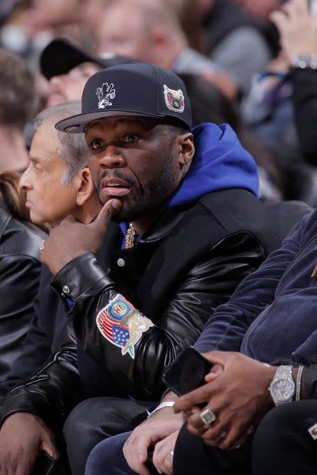 closeup of 50 cent sitting at a game