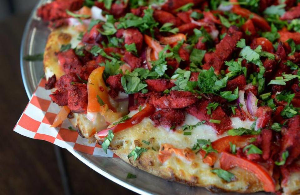A tandoori chicken masala pizza is displayed at The Curry Pizza Company in this file photo from 2018. Craig Kohlruss/ckholruss@fresnobee.com