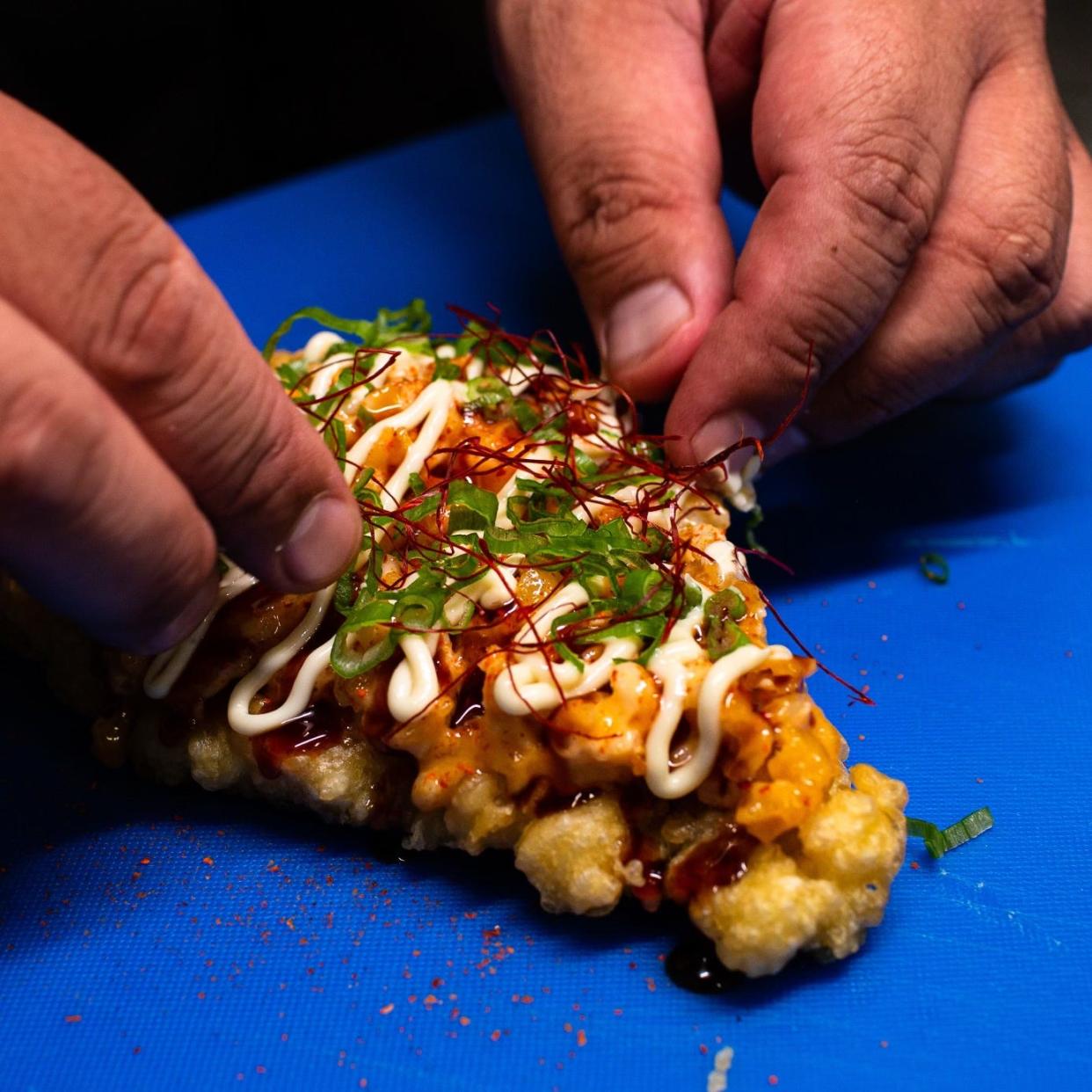 Bang Bang Shrimp Pizza -- with tempura-fried nori with rice, Bang Bang shrimp, green onions, chili strings and more -- will be one of several offerings at the one-time Sushi Pizza Party event being held May 18, 2024, at Skye Lounge in downtown Nashville
