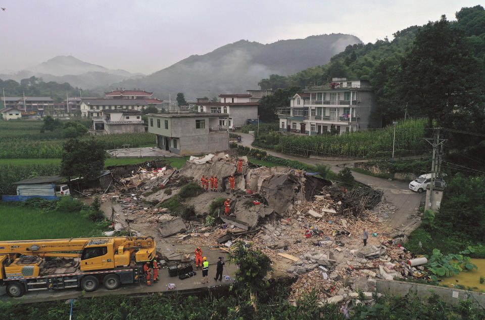 In this photo released by Xinhua News Agency, rescue workers search for trapped people at a collapsed building after an earthquake in Shuanghe Town in Changning County of Yibin City, southwest China's Sichuan Province, Tuesday, June 18, 2019. The strong earthquake that hit Sichuan province in southern China late Monday night. (Zeng Lang/Xinhua via AP) NO SALES