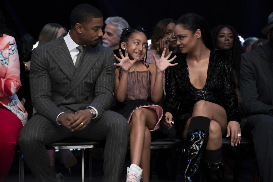 This image released by MGM shows Michael B. Jordan, from left, Mila Kent and Tessa Thompson in a scene from "Creed III." (Eli Ade/MGM via AP)