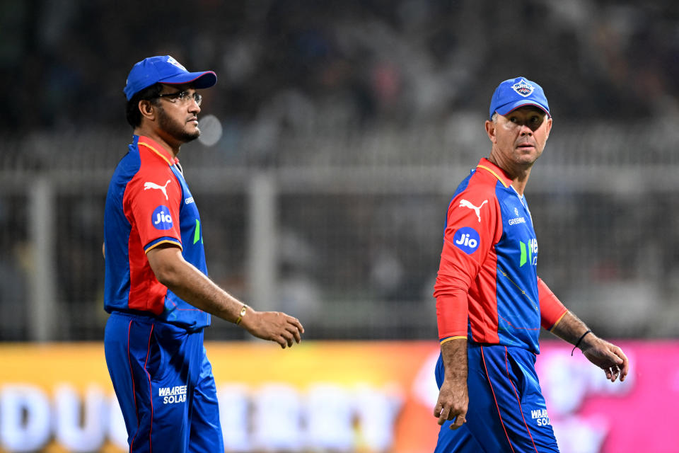 Delhi Capitals's Director of Cricket and mentor Sourav Ganguly (L) with head coach Ricky Ponting walks across the field during the Indian Premier League (IPL) Twenty20 cricket match between Kolkata Knight Riders and Delhi Capitals at the Eden Gardens in Kolkata on April 29, 2024. (Photo by DIBYANGSHU SARKAR / AFP) / -- IMAGE RESTRICTED TO EDITORIAL USE - STRICTLY NO COMMERCIAL USE -- (Photo by DIBYANGSHU SARKAR/AFP via Getty Images)