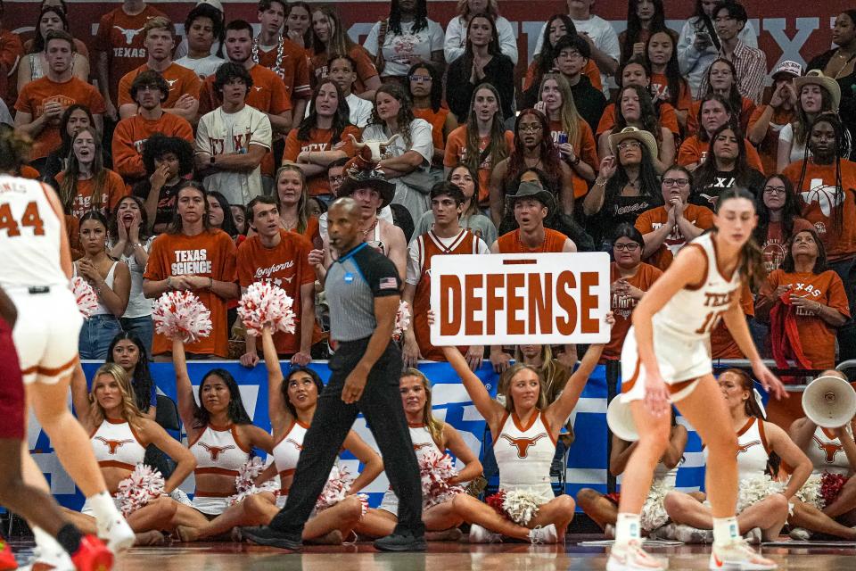 Texas cheerleaders encourage the Longhorns' defense during Sunday's 65-54 win over Alabama in the NCAA Tournament. The Crimson Tide shot just 34% from the field and were outrebounded 45-34.