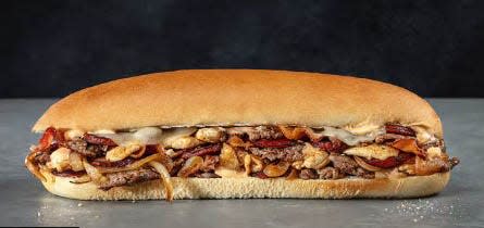 Among the popular signature sandwiches at Jon Smith Subs is The Gator, made with sirloin steak, chicken, kielbasa, and onions and provolone in "swamp sauce" topped with bacon bits.