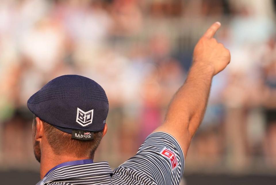 Bryson DeChambeau celebrates with the trophy after winning the U.S. Open golf tournament.