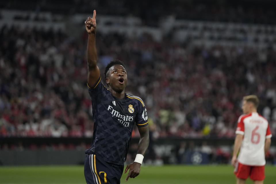 Real Madrid's Vinicius Junior celebrates after scoring his side's opening goal during the Champions League semifinal first leg soccer match between Bayern Munich and Real Madrid at the Allianz Arena in Munich, Germany, Tuesday, April 30, 2024. (AP Photo/Matthias Schrader)