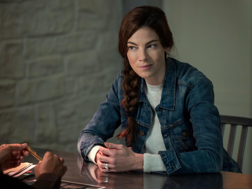 Michelle Monaghan on Echoes sitting at table with hands clasped