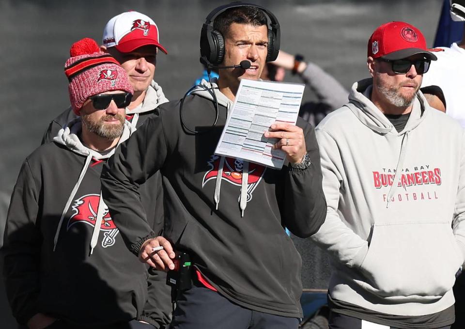 Tampa Bay Buccaneers offensive coordinator Dave Canales, center, stands along the team’s sideline during action against the Carolina Panthers at Bank of America Stadium in Charlotte, NC on Sunday, January 7, 2024. The Buccaneers defeated the Panthers 9-0.