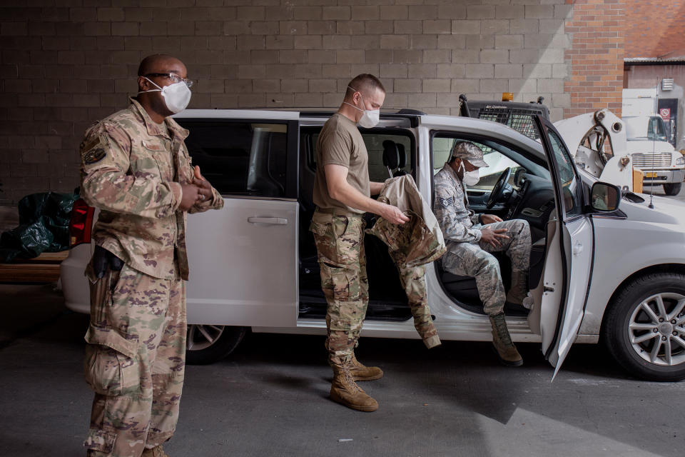 Senior Airman Steve Ollennu, at left, leads a National Guard team of three. A May 2 removal call took them to Lincoln Medical Center in the Bronx, the hospital where Ollennu was born. | Natalie Keyssar for TIME